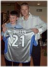 Bullen presenting signed shirt