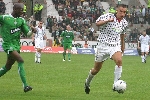 Pars v Celtic 28th August 2005. Bartosz Tarachulski v Mo Camara.